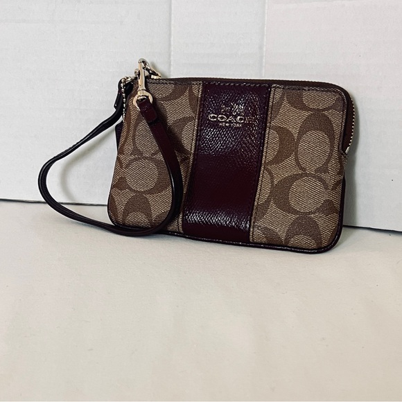 Coach Handbags - Coach Corner Zip Wristlet In Signature Canvas